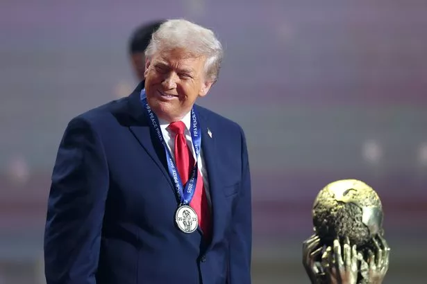 WASHINGTON, DC - DECEMBER 05: U.S. President Donald Trump receives the FIFA Peace Prize during the FIFA World Cup 2026 Official Draw at John F. Kennedy Center for the Performing Arts on December 05, 2025 in Washington, DC. (Photo by Dan Mullan/Getty Images)