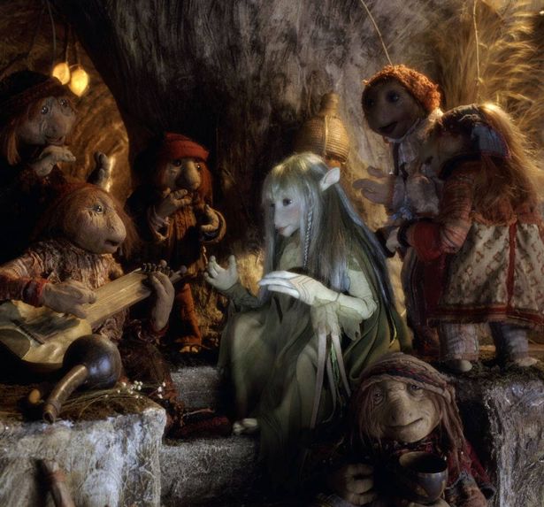 The Gelfling Kira is entertained by the Podlings, in a scene from the animatronic fantasy film 'The Dark Crystal', 1982