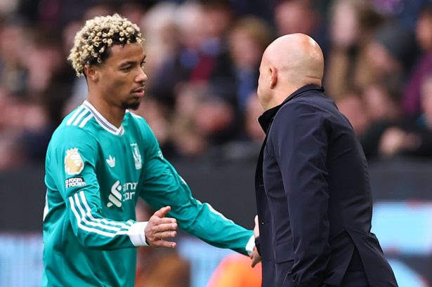 Liverpool head coach Arne Slot (right) with striker Hugo Ekitike