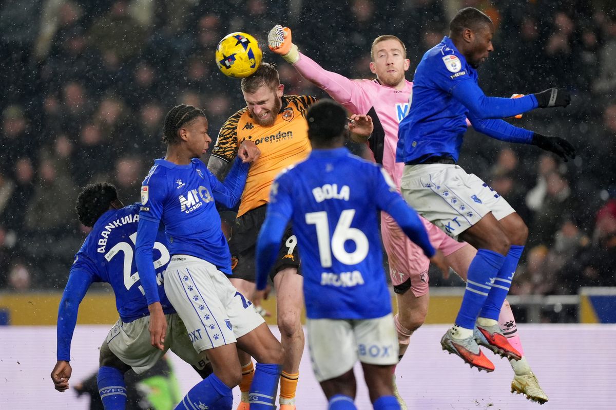 Watford goalkeeper Egil Selvik clears the ball whilst under pressure from Hull City's Oliver McBurnie