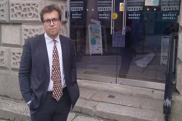 St Austell's Labour MP Noah Law at the entrance to the Market House