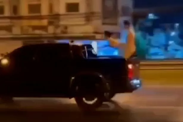 The couple got steamy in the back of a moving truck