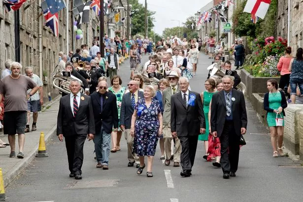 The floral dance makes its way down through the village during Praze Fair Show