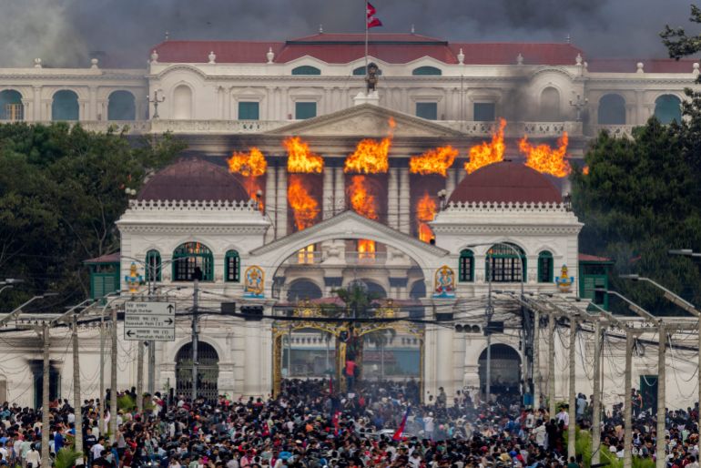 Protesters torch Nepal parliament as PM resigns amid turmoil