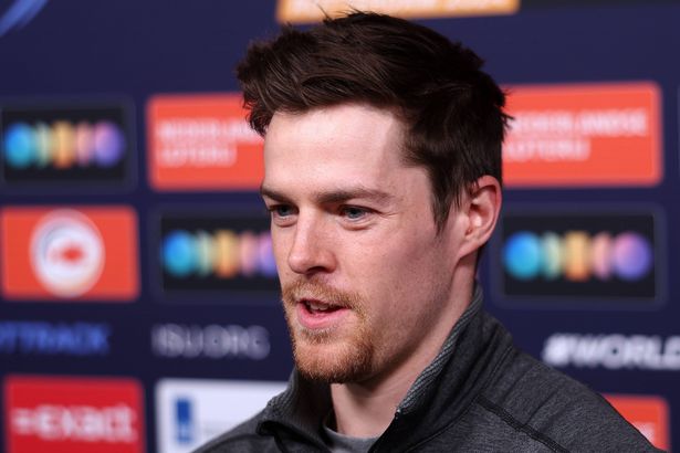 Brendan Corey speaks with the media