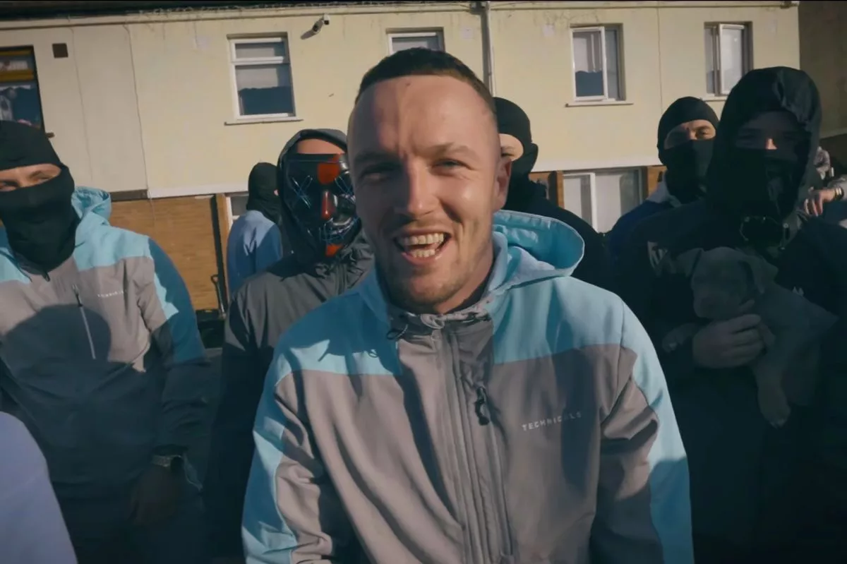 Drogheda gangster, Dean Thornton (centre in grey and blue tracksuit) in a music video filmed on the streets of Drogheda