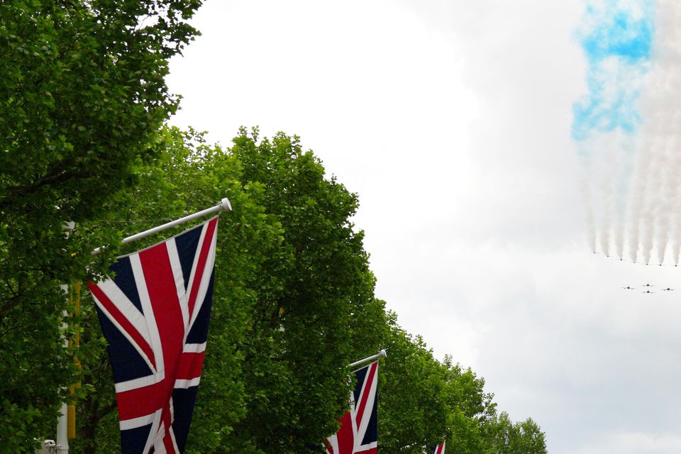 Members of the public along the Mall watch the flypast to mark the 80th anniversary of VE Day (Carl Court/PA)