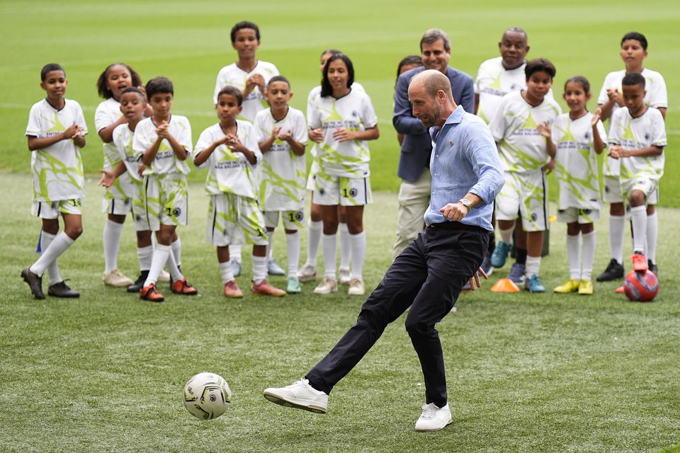 The Prince of Wales takes a penalty at a community football event at the Maracana Stadium (Aaron Chown/PA)