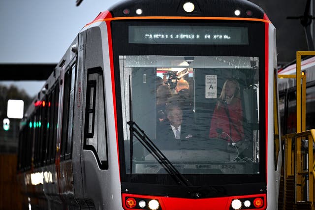 The King takes controls a tram-train at the official opening of the South Wales Metro Depot in Taff’s Well on his 77th birthday