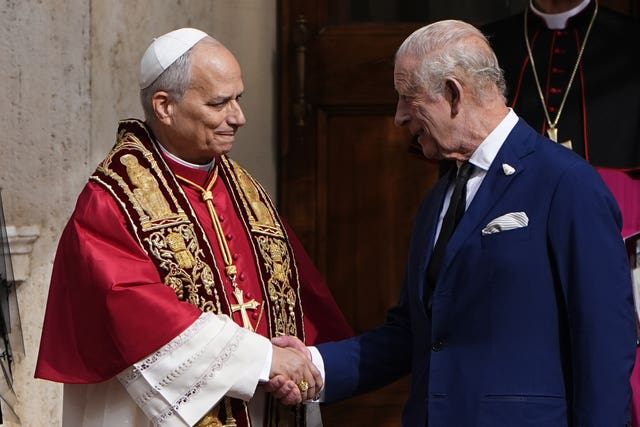The King says goodbye to the Pope in the San Damaso Courtyard, in St Peter’s Square