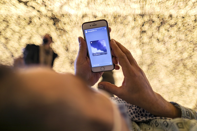 A person checks a social media reel while resting. (Photo: Reuters)