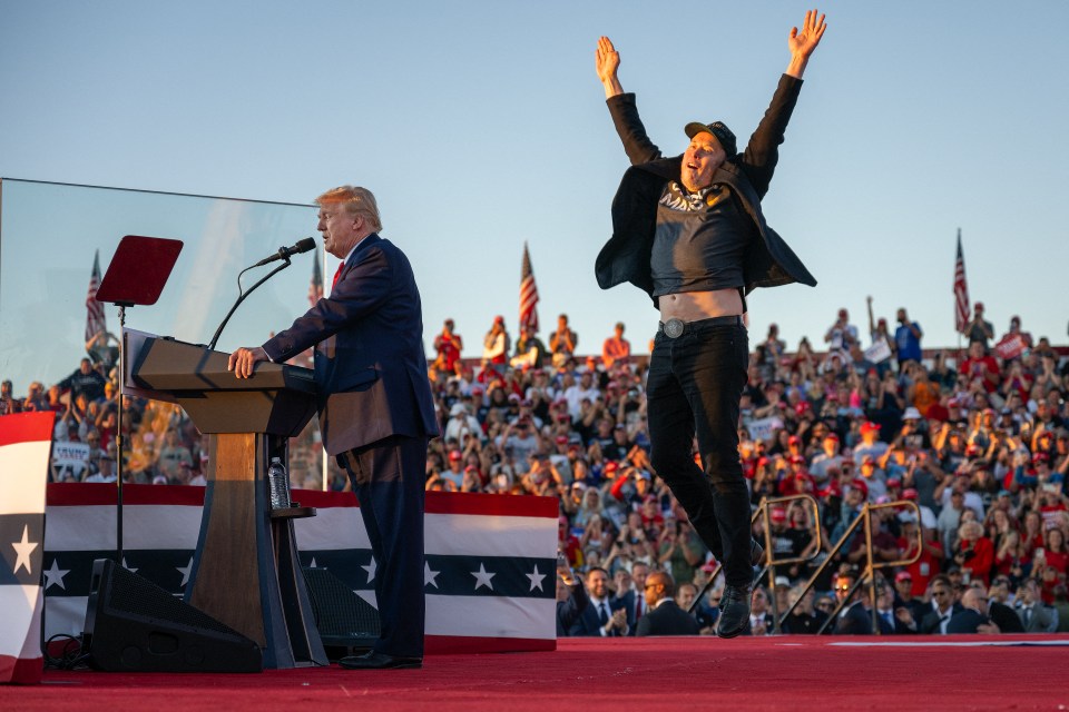 Elon Musk jumping on stage at a Donald Trump rally.