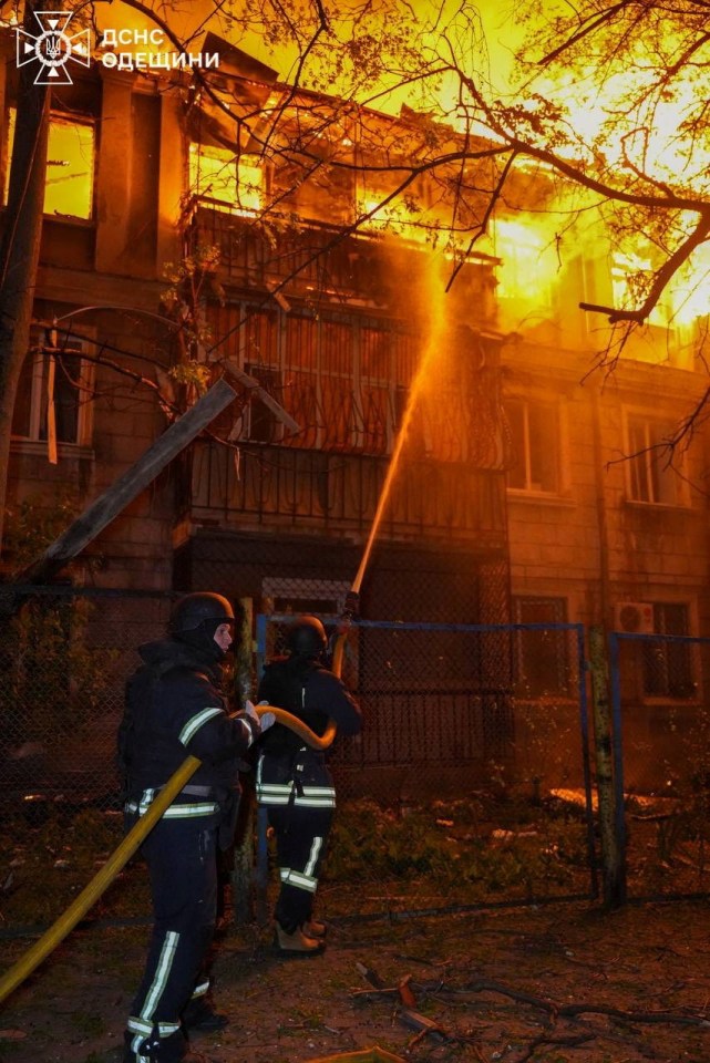 Firefighters battling a fire at a building in Odesa, Ukraine.