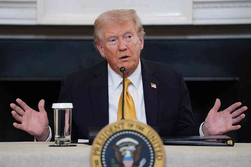 President Donald Trump answers questions from reporters during a roundtable on criminal cartels in the State Dining Room of the White House, Thursday, Oct. 23, 2025, in Washington. (AP Photo/Evan Vucci)