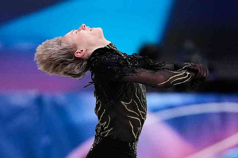 Ilia Malinin of the United States competes during the men's free skate program in figure skating at the 2026 Winter Olympics, in Milan, Italy, Friday, Feb. 13, 2026. (AP Photo/Natacha Pisarenko)