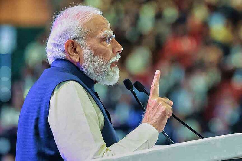 In this photo provided by Indian Prime Minister's Office, India Prime Minister Narendra Modi speaks during the AI Summit in New Delhi, India, Thursday, Feb. 19, 2026. (Indian Prime Minister's Office via AP)