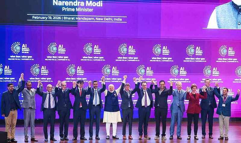 India's Prime Minister Narendra Modi, seventh left, poses for photographs with chief executive officers of various AI groups during the AI Summit in New Delhi, India, Thursday, Feb. 19, 2026. (Indian Prime Minister's Office via AP)