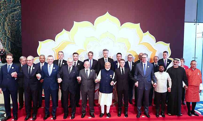 India's Prime Minister Narendra Modi, center, hold hands and poses for photographs with various head of states of participating countries during the AI Summit in New Delhi, India, Thursday, Feb. 19, 2026.