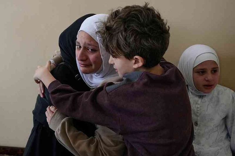 Relatives of Ghadir Baalbaki, 19, who was killed on Tuesday in an Israeli airstrike, mourn during her funeral in the southern port city of Tyre, Lebanon, Wednesday, April 15, 2026. (AP Photo/Hussein Malla)
