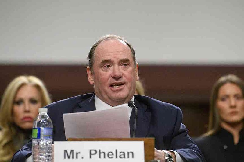 FILE - John Phelan appears before a Senate Committee on Armed Services hearing on Capitol Hill, Feb. 27, 2025, in Washington. (AP Photo/Rod Lamkey, Jr., file)