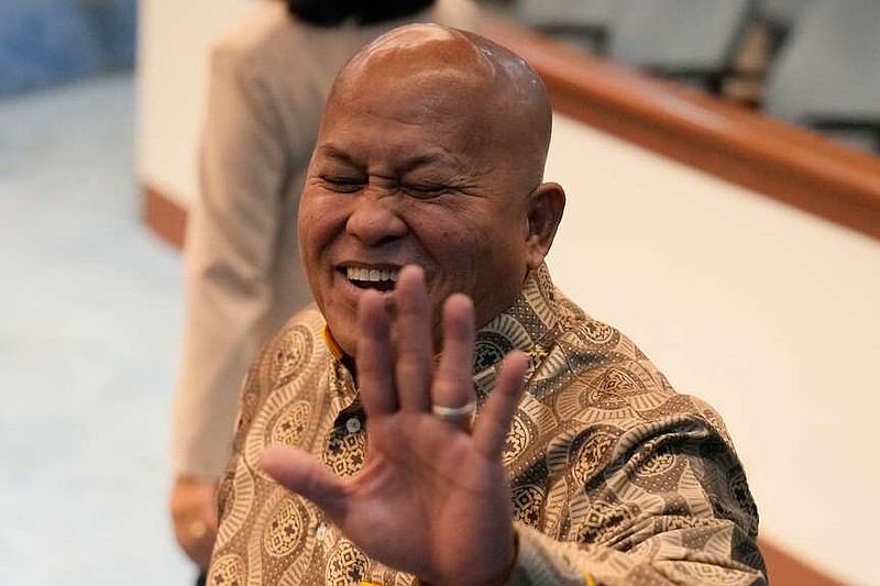 Philippine Senator Ronald dela Rosa gestures to reporters at the Philippine Senate in Pasay, Philippines on Wednesday, May 13, 2026. (AP Photo/Aaron Favila)