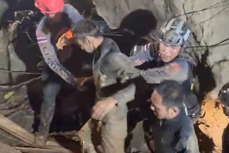 This video grab provided by the Association Of Volunteers For Lao People, shows rescuers evacuating the first of five villagers, center, who had been trapped in a cave in Xaisomboun province, Laos, Friday, May 29, 2026. (Association Of Volunteers For Lao People via AP)
