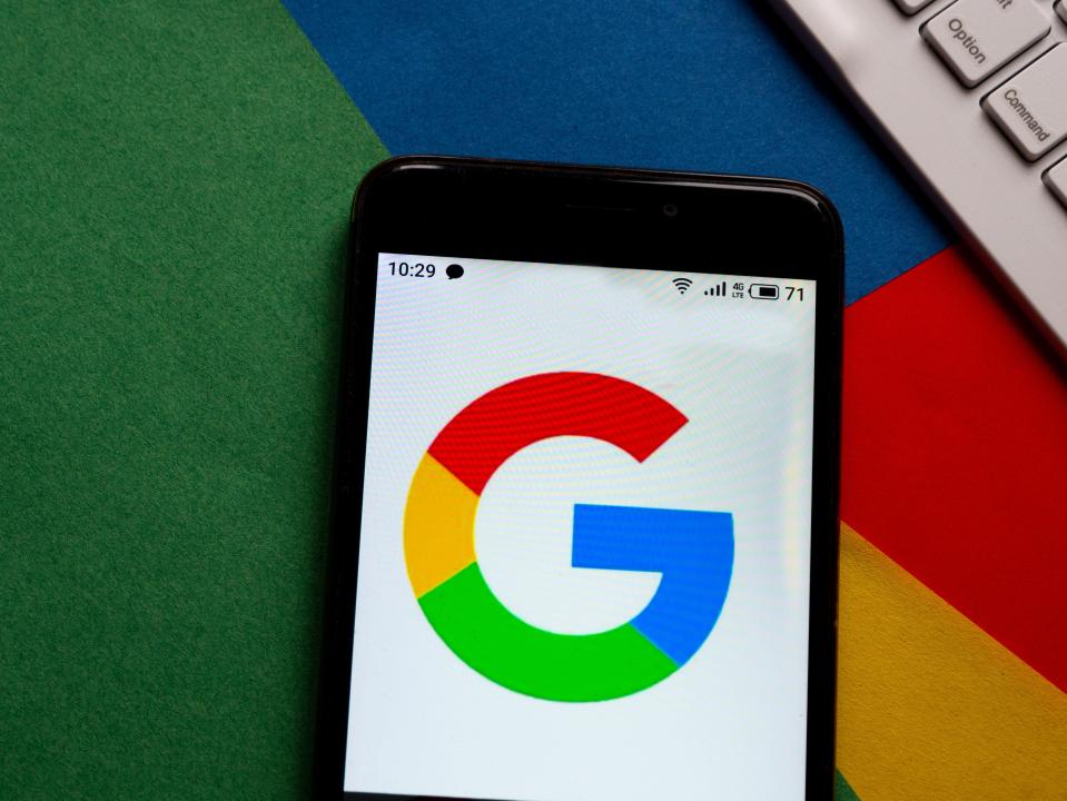a phone with the google logo on the screen