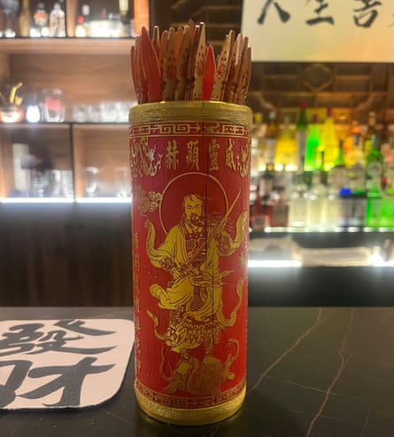 Fortune telling sticks in a Beijing bar.