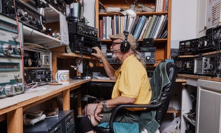 Man wears headphones and adjusts dial