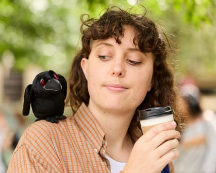Lucy Knight with a raven shoulder plushie