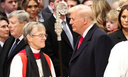 A man who is Donald Trump and a female bishop walk past each other in a crowd of people