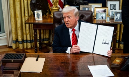 a man holds up a document