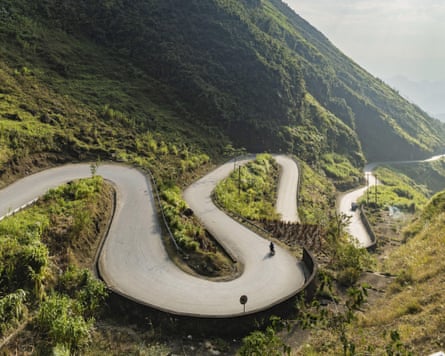 A road winds through mountainous scenery