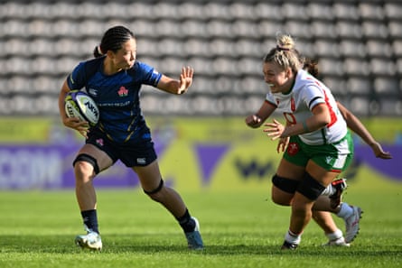 Japan’s Iroha Nagata looks to hand off Alex Callender of Wales during the WXV 2 2024
