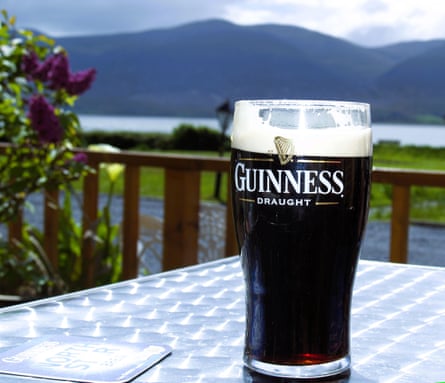 A pint of Guinness by the shore of Tralee Bay in County Kerry,