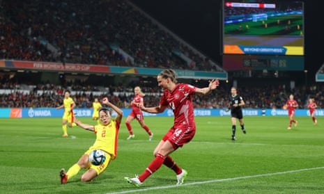 Li Mengwen of China battles for possession with Nicoline Sorensen of Denmark.