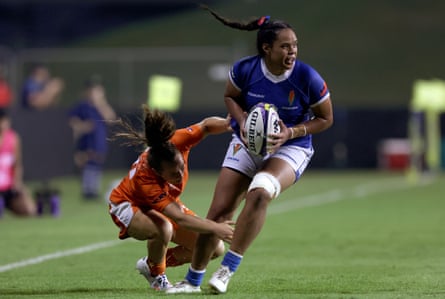 Cassie Siataga of Samoa on the attack against Netherlands at WXV 3 in 2024.
