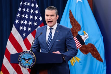 Pete Hegseth speaking at a lectern with a 'Department of War' seal