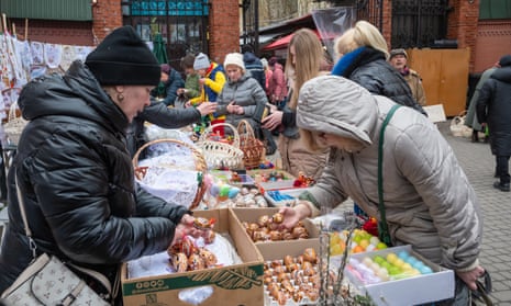 People buy Easter eggs, baskets, bouquets of willow branches at an Easter fair in Lviv. In Ukraine, decorated willow branches are traditionally consecrated on Palm Sunday.