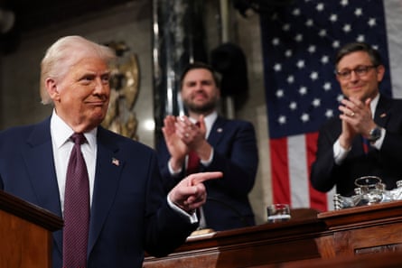 a man in a suit pointing
