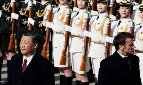 Chinese President Xi Jinping, left, and France's President Emmanuel Macron review troops during a welcome ceremony at the Great Hall of the People in Beijing, China, Thursday, 6 April 2023.