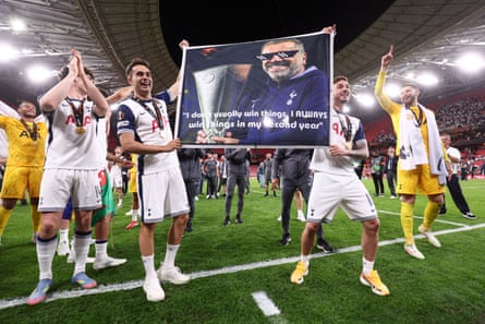 Sergio Reguilón and James Maddison with a banner of Ange Postecoglou