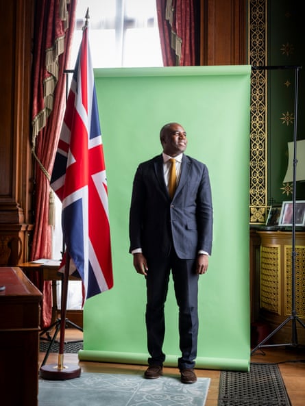 David Lammy, photographed at the Foreign Office in London last month. He is stood in front of a green backdrop with a union jack to one side