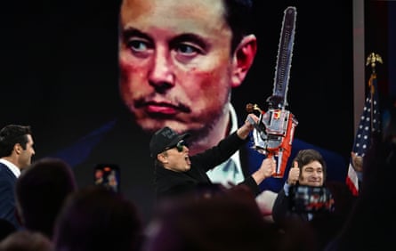 a man screams while holding a chainsaw