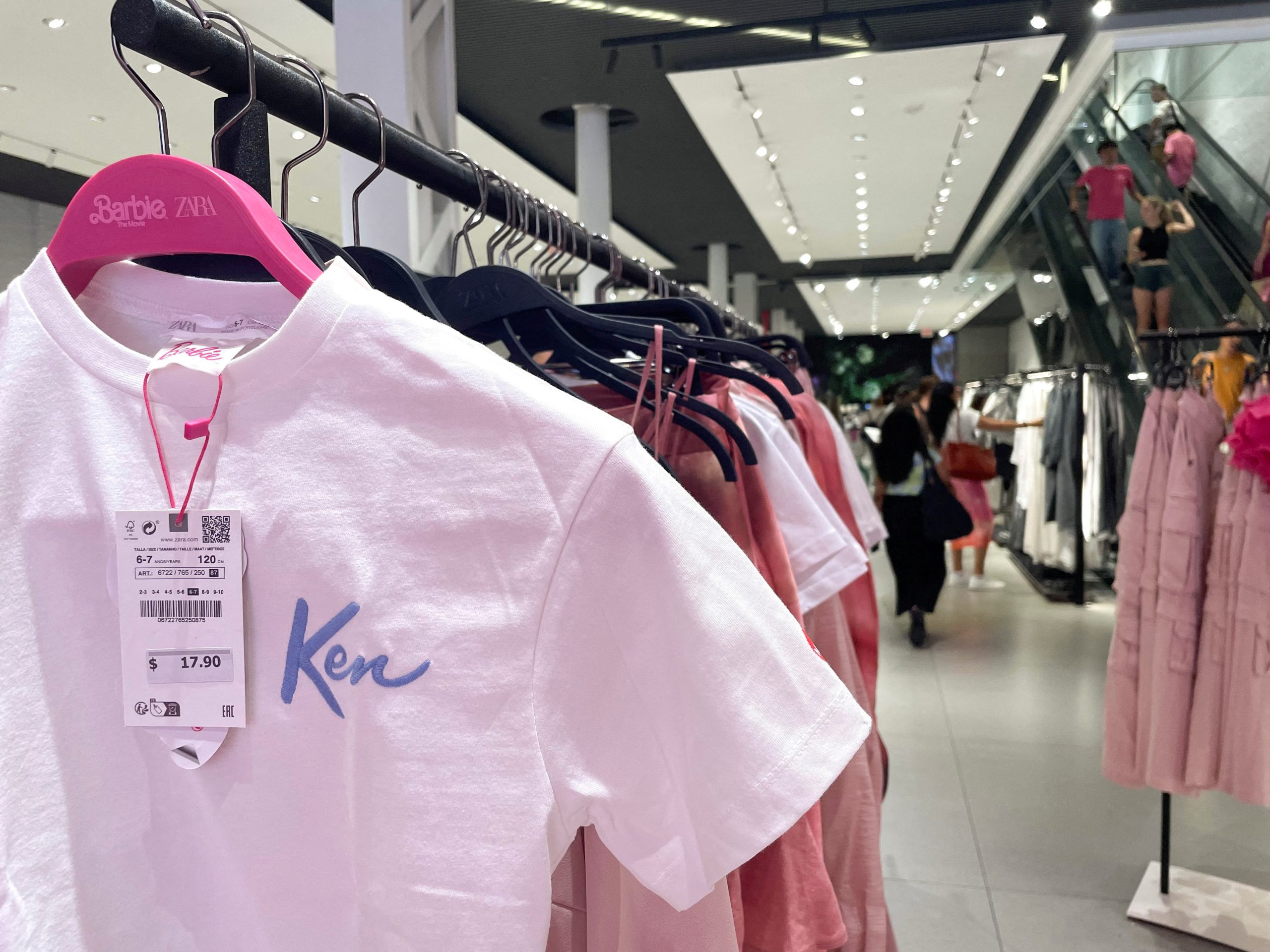 Shoppers browse Barbie-themed merchandise during the Barbie pop-up in Zara's Soho store in New York