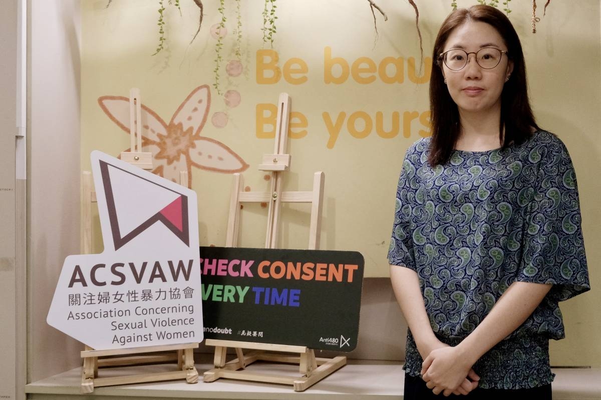 This photo taken on July 22, 2025 shows Doris Chong, executive director for the Association Concerning Sexual Violence Against Women (ACSVAW), posing outside the association's office in Hong Kong. AFP PHOTO