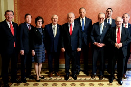 men and women looking at camera