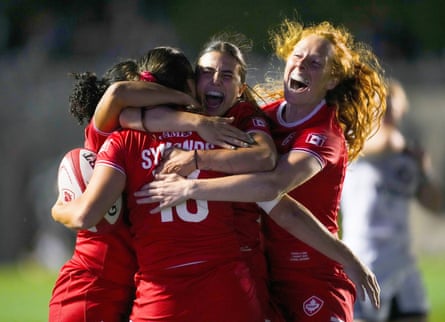Canada’s Florence Symonds (13) celebrates her try with teammates Fancy Bermudez (14), left, Julia Schell (15), against the US in August