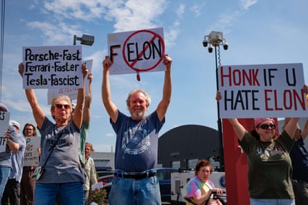 people holding signs