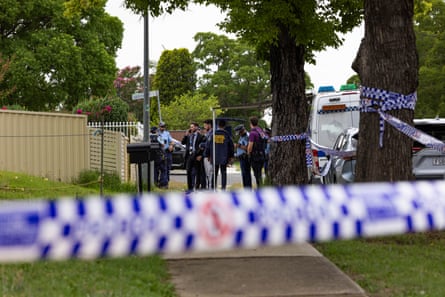 Police outside the Bonnyrigg home which was raided on Sunday night.